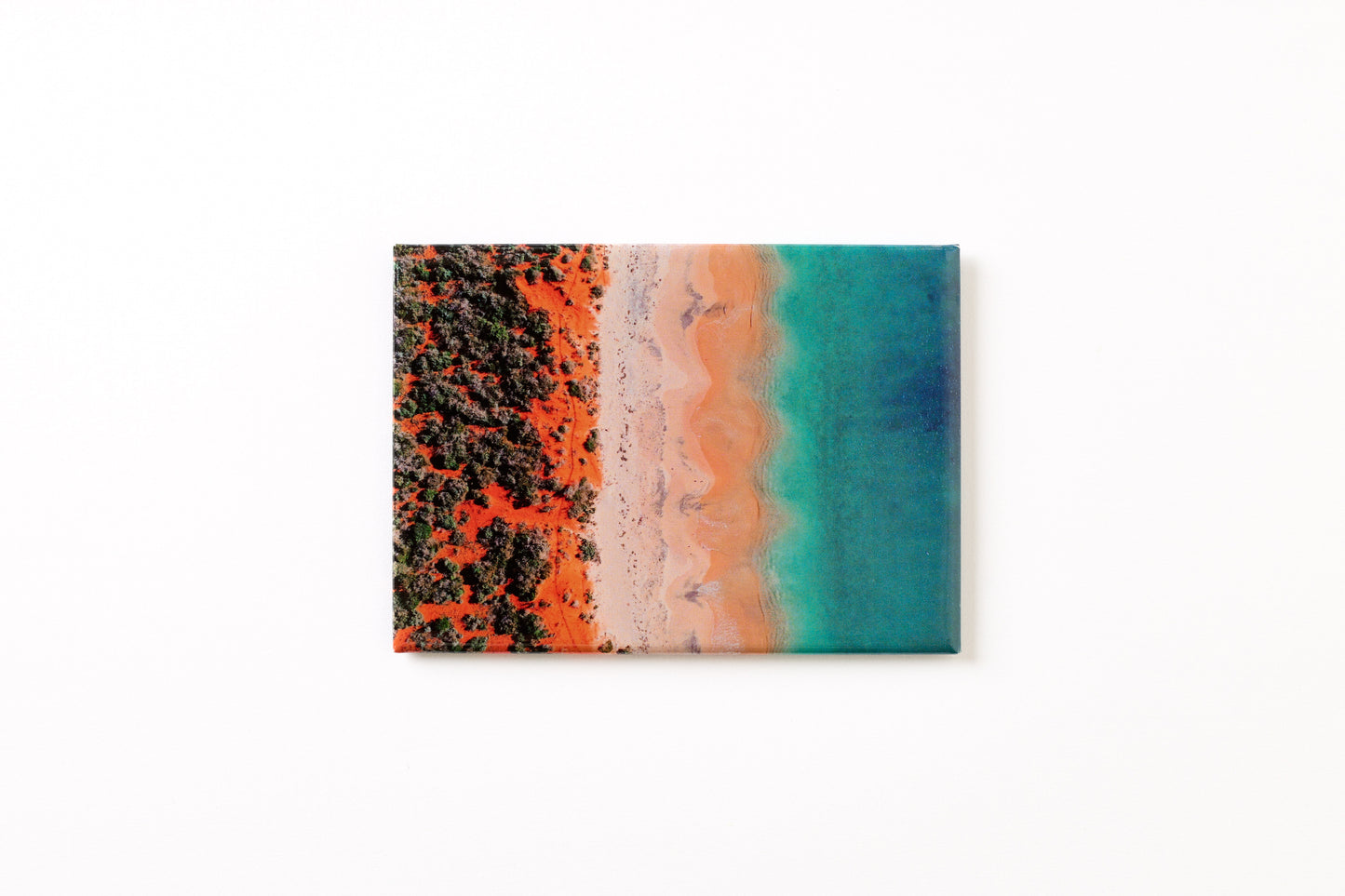 Australian Prints by Mackenzie Sweetnam. An aerial image of Bottle Bay, Western Australia on a fridge magnet.