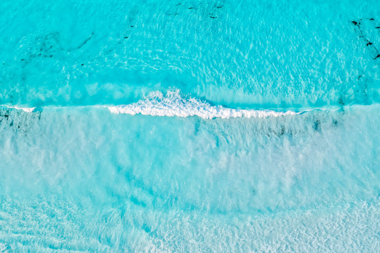 Australian Prints by Mackenzie Sweetnam. An aerial view of a wave at Lucky Bay, Western Australia