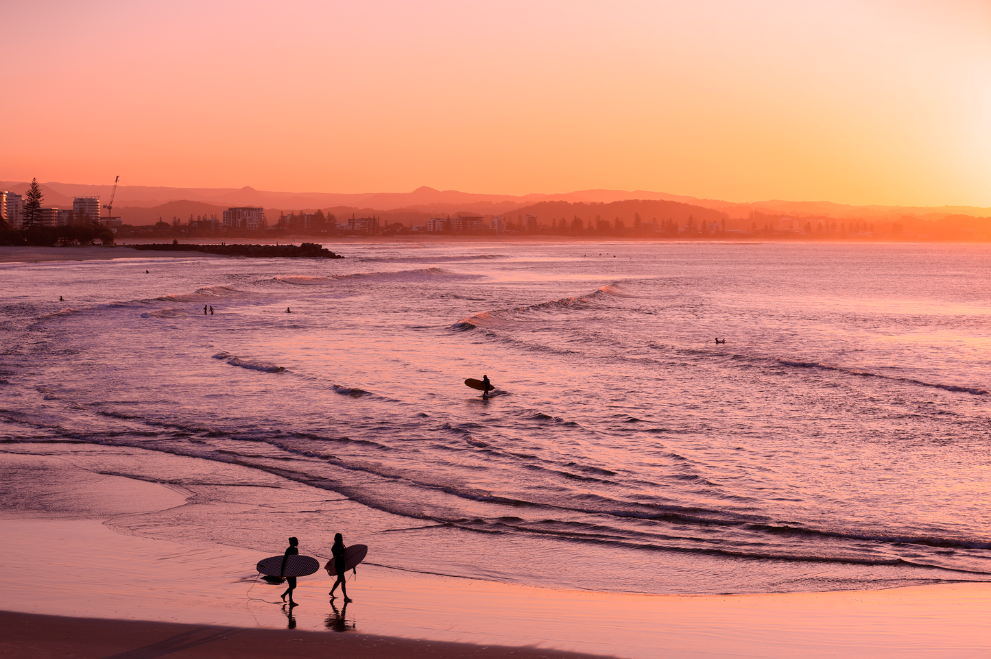 Australian Prints by Mackenzie Sweetnam. A sunset view of Greenmount beach with surfers.